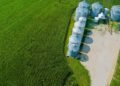 Steel grain storage bins on a Midwest farm at harvest time used to store corn and soybeans