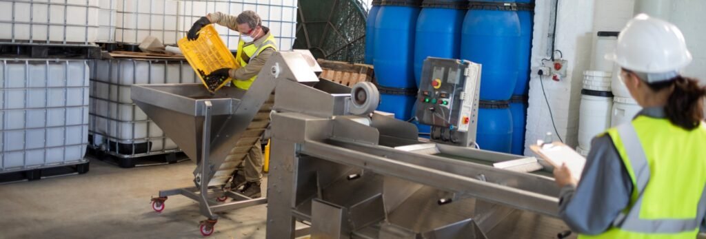 chemical plant worker weighing drum industrial floor scale