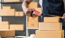 Shipping operative measuring package dimensions to calculate dimensional weight in a warehouse