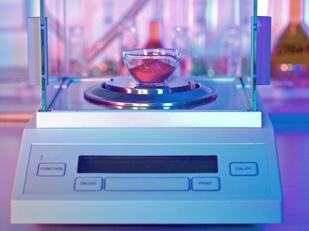 Analytical balance placed on an anti-vibration table in a controlled laboratory environment away from air vents and direct sunlight