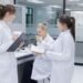 Laboratory assessor reviewing ISO IEC 17025 accreditation documentation for analytical balance calibration program during laboratory audit