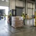 Loaded pallet being weighed on a heavy duty NTEP certified pallet scale at a warehouse shipping dock before LTL carrier pickup