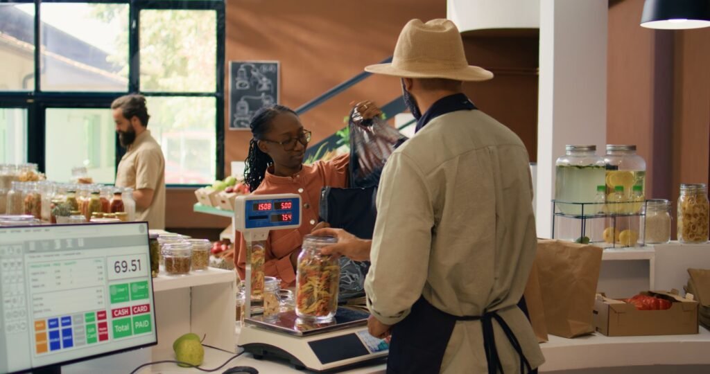 POS scale connected to a retail checkout terminal via RS-232 serial cable for direct weight data transmission during grocery store transactions