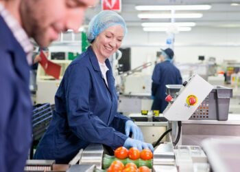 In-motion checkweigher on a food production line verifying net content compliance of packaged products against NIST Handbook 133 MAV requirements