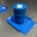 55-gallon drum being rolled onto a low-profile drum scale at an industrial chemical facility for incoming material weight verification