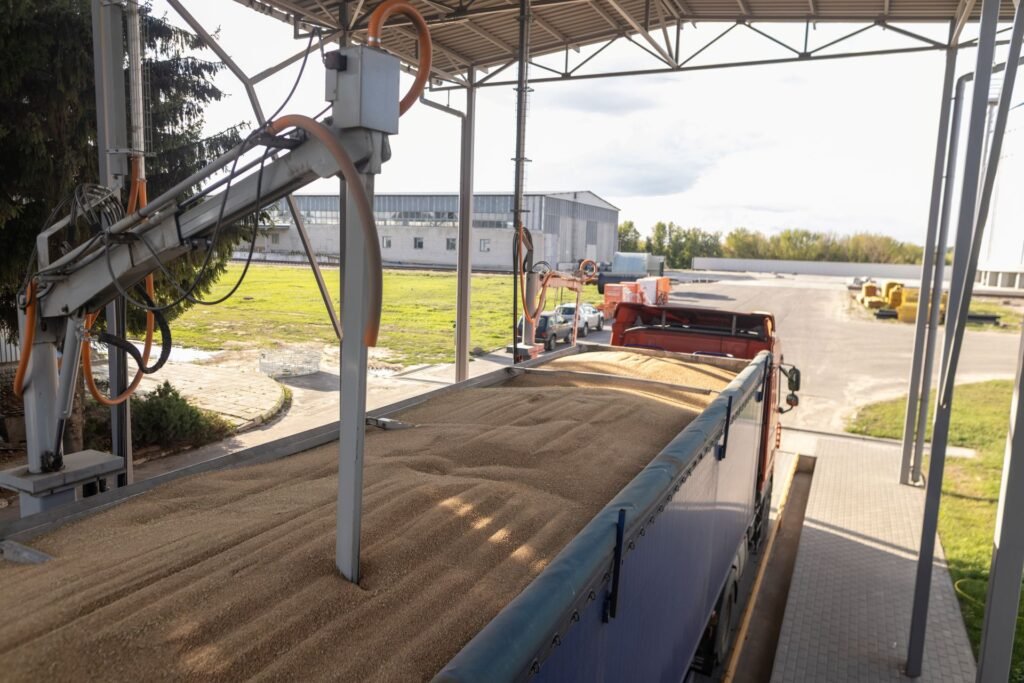 Farm truck on a portable axle scale at a grain loading facility for weight verification before road transport