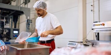 Stainless steel IP69K washdown floor scale in a food processing facility