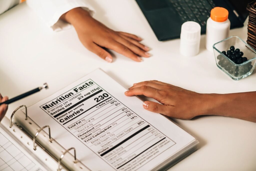 Label printing scale display showing PLU product lookup with stored ingredient and allergen information for printing on pre-packaged retail food labels