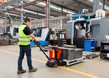 Warehouse distribution center with floor scale at receiving dock and pallet weighing operations for inbound and outbound freight