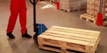 Side-by-side comparison of a U-frame pallet scale and a stationary floor scale with ramp in a warehouse environment