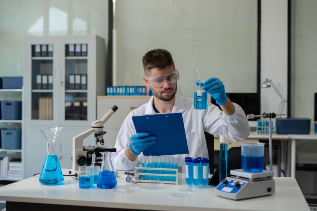 Laboratory manager reviewing analytical balance calibration certificate with measurement uncertainty documentation for USP Chapter 41 compliance