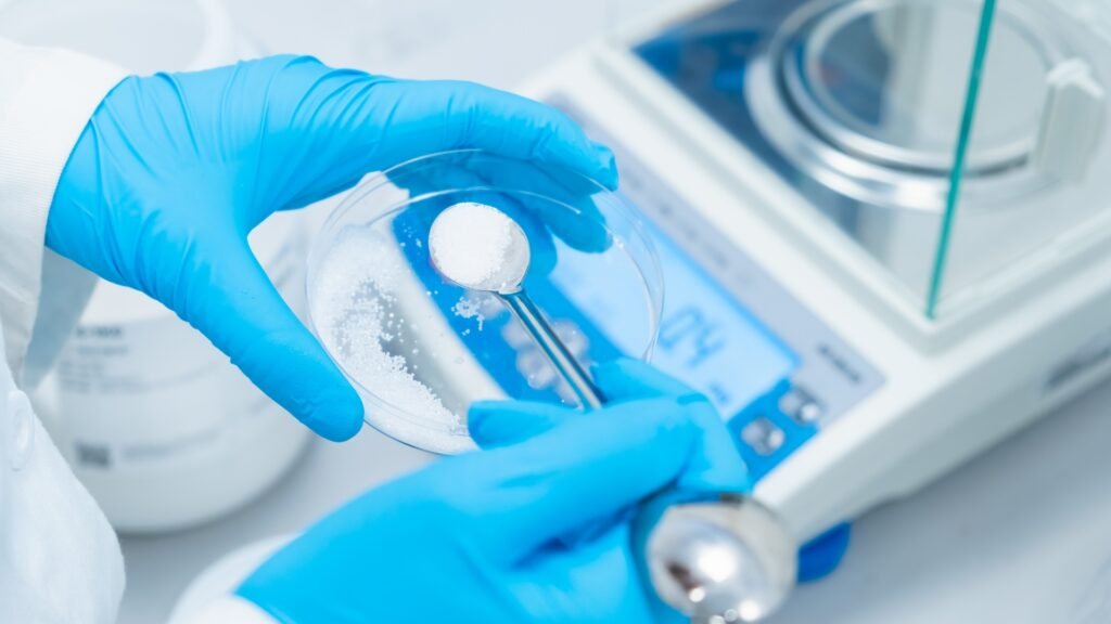 Precision top-loading balance on a laboratory bench used for routine solution preparation and bulk reagent weighing