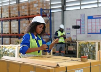 Warehouse shipping dock operations showing pallet scale parcel scale and freight weighing equipment in a commercial logistics facility