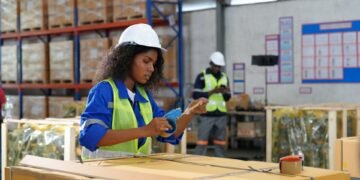 Warehouse shipping dock operations showing pallet scale parcel scale and freight weighing equipment in a commercial logistics facility