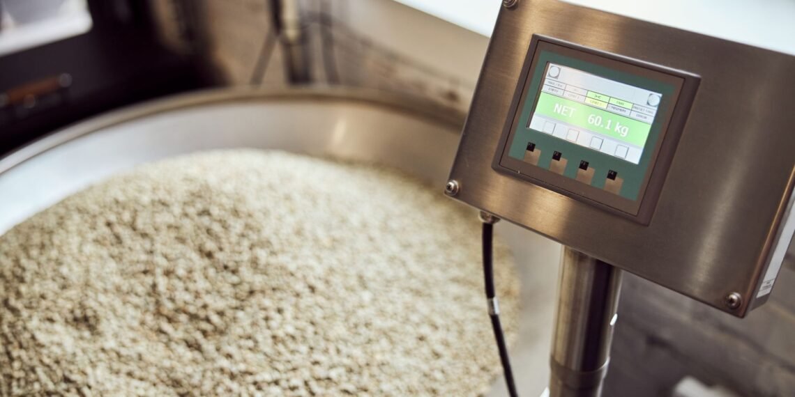 Stainless steel industrial floor scale in a food processing facility showing corrosion-resistant platform suitable for washdown cleaning