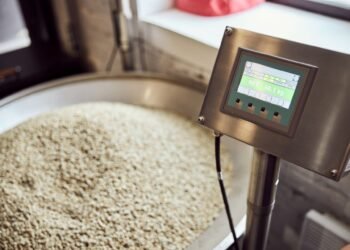 Stainless steel industrial floor scale in a food processing facility showing corrosion-resistant platform suitable for washdown cleaning