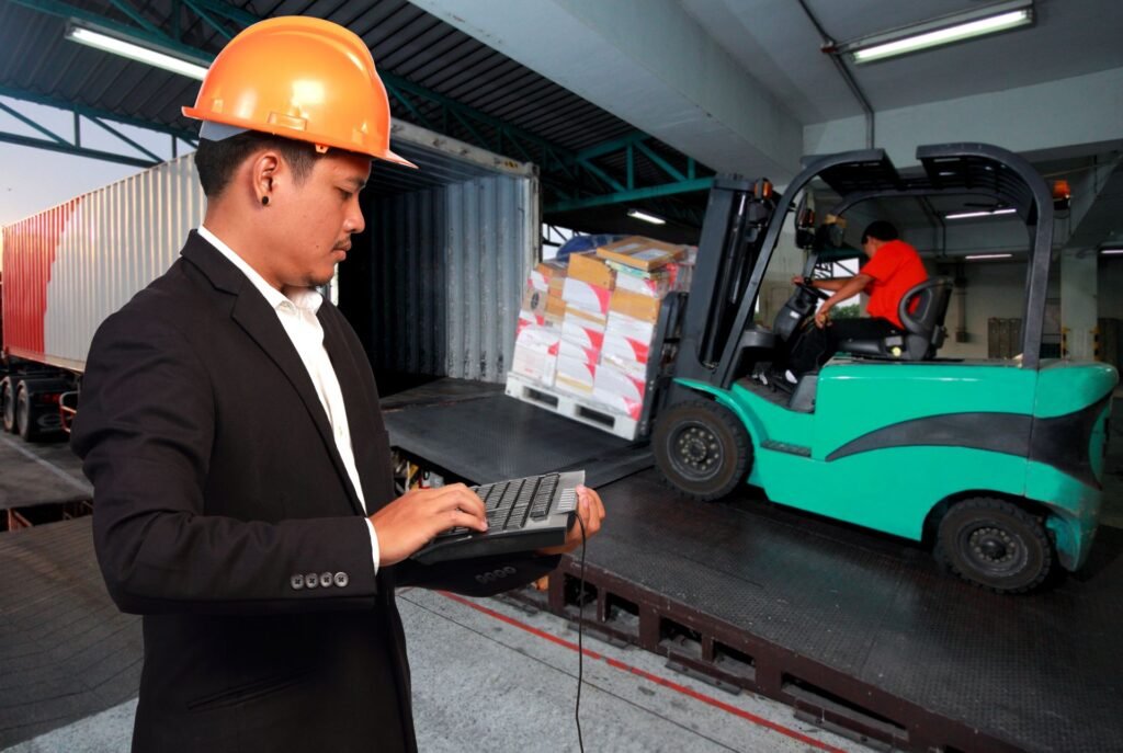 Warehouse receiving dock with a heavy-duty floor scale and ramp for weighing incoming freight pallets