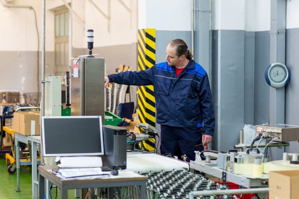 Quality manager reviewing industrial scale calibration certificates and as-found as-left records for ISO 9001 quality system audit documentation