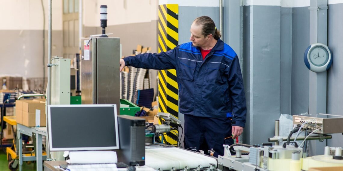 Calibration technician placing a certified NIST-traceable test weight on a warehouse floor scale during professional calibration