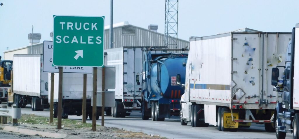 Loaded truck and shipping container on a port terminal weighbridge for SOLAS VGM Method 1 verified gross mass measurement