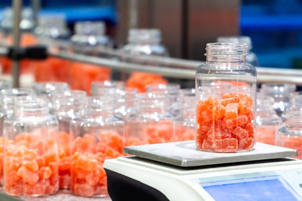 State weights and measures inspector weighing individual packages from a food production lot on a certified reference scale during a NIST Handbook 133 compliance inspection
