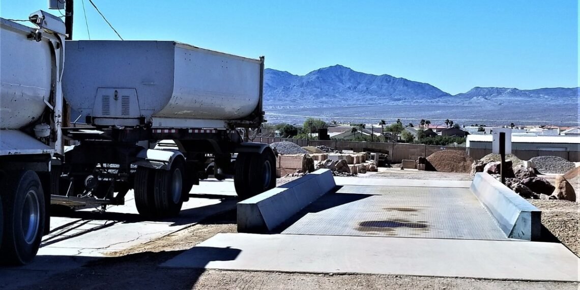 How to buy a truck scale: an above-ground truck scale with a dump truck trailer on the deck