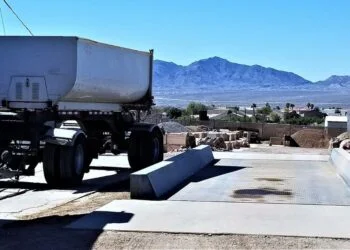 How to buy a truck scale: an above-ground truck scale with a dump truck trailer on the deck