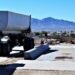 How to buy a truck scale: an above-ground truck scale with a dump truck trailer on the deck